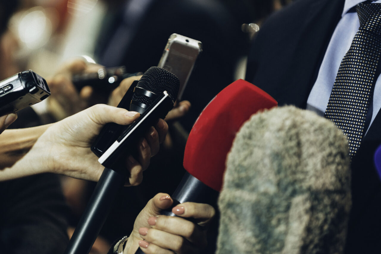 Interviewing business man on press conference