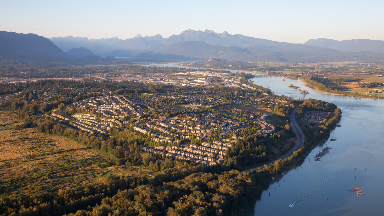 Aerial view of residential neighborhood in Port Coquitlam during a sunny summer sunset. Taken in Vancouver, BC, Canada.