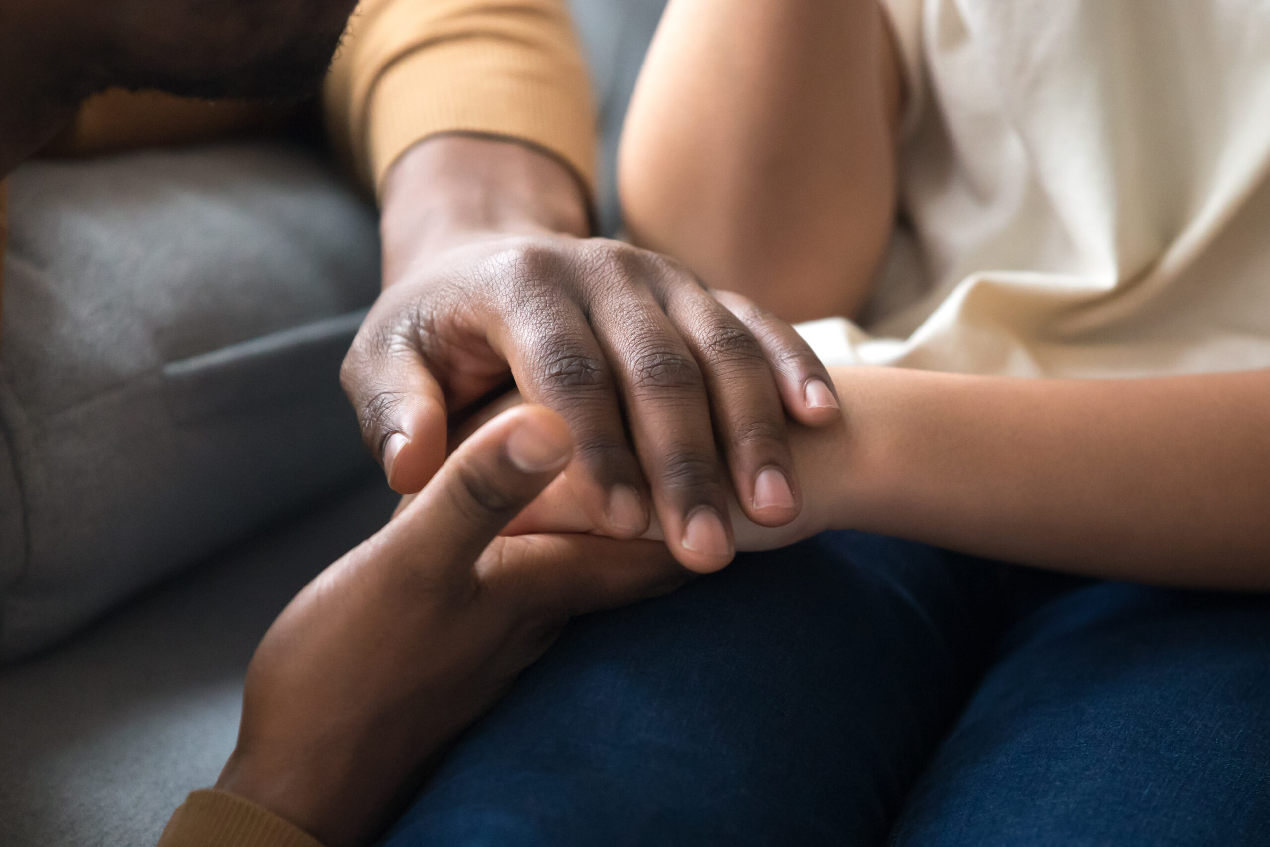 African american father dad holding hands of child as charity and support concept, children protection, kid adoption donation, black family love care connection, parenthood, upbringing, close up view