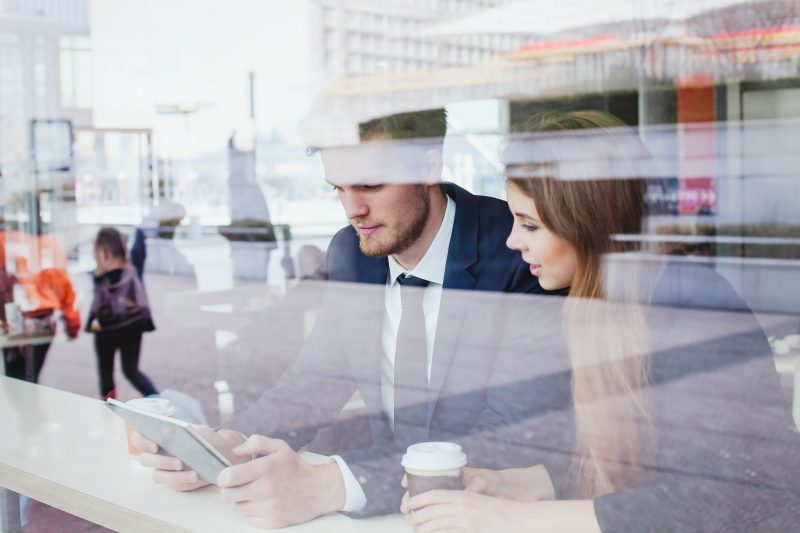 Two business people looking at iPad together