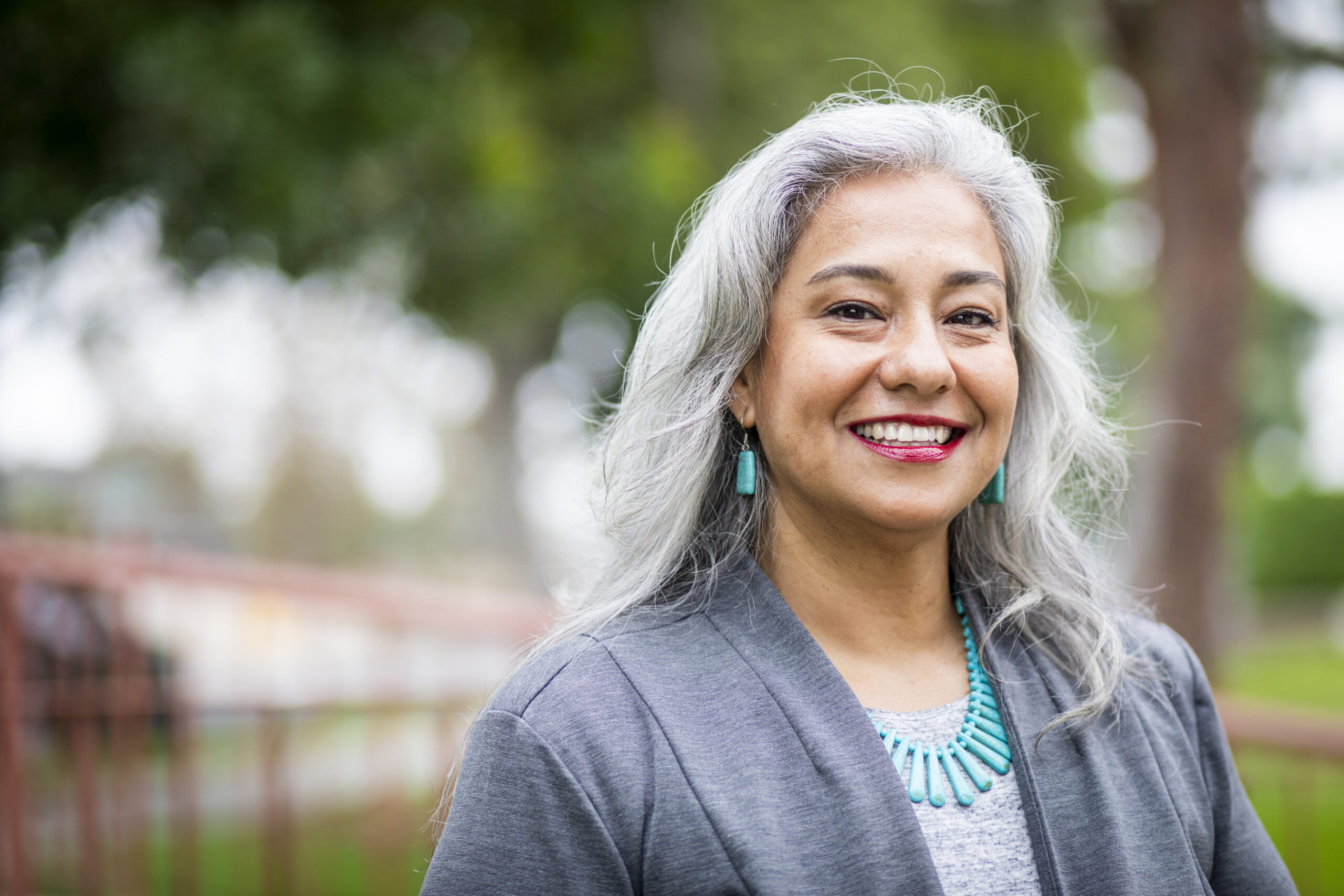 A portrait of a senior mexican female administrator on a campus