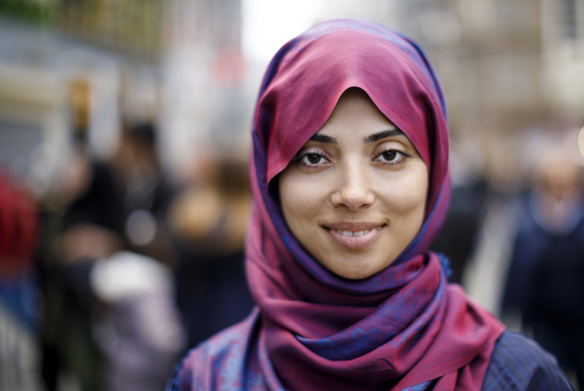Portrait of smiling muslim woman outdoors